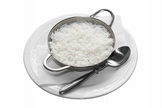 white rice in white plate with spoon isolated on white