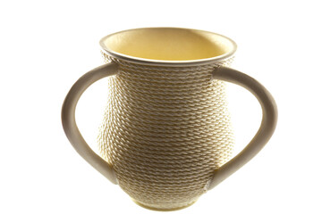 The Ritual Natla.  A cup used for ritual hand washing in Judaism. A two- handled Natla cup . White...