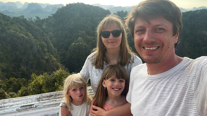 A selfie of a family in the mountains in Thailand