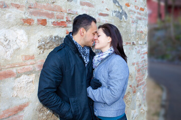 Young couple playing around in the nature - front view.