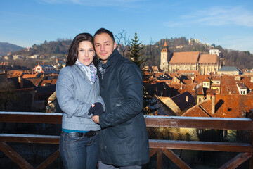 Young couple playing around in the nature - front view.
