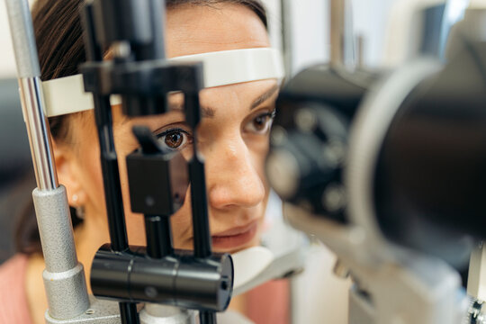 Patient at an eye check-up in phoropter