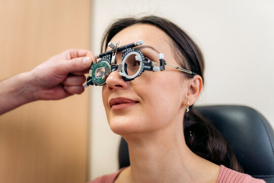 Patient at an eye check-up in phoropter