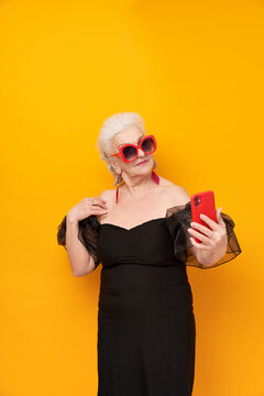 "Emotional portrait of a senior woman on a colored background. Kitsch,