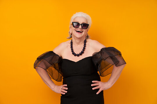 "Emotional portrait of a senior woman on a colored background. Kitsch,