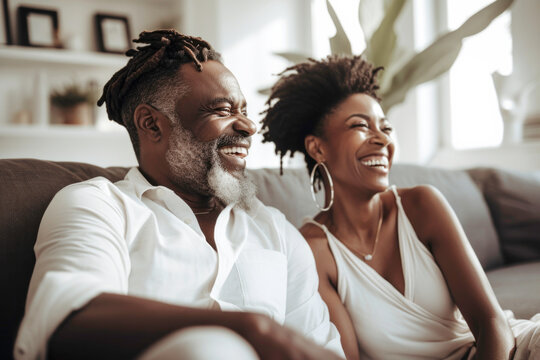 Portrait of happy mature successful Black couple laughing on sofa. Generative AI.