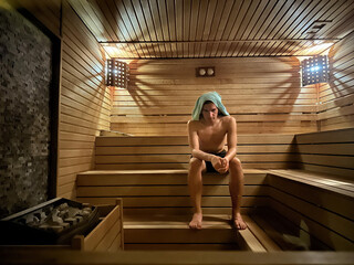 Young man in sauna