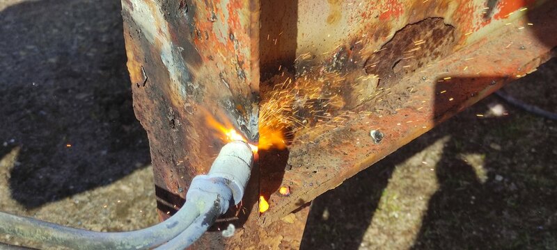 Gas torch with flame closeup - gas cutting of metal