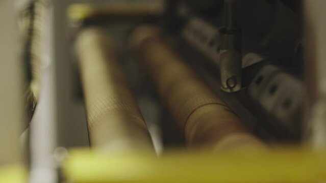 The glass goes into the machine on rollers and goes through the tempering process