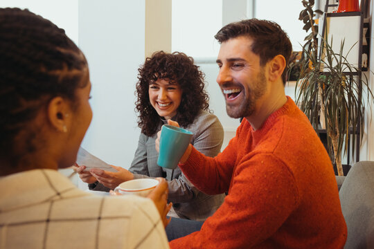 Happy couple drinking coffee in cafe
