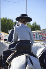 Horse riders in the famous April fair of Seville,  Andalusia,  Spain 