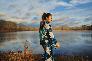 Asian woman in kimono by the lake