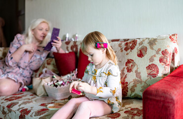 mother and daughter preen for a party