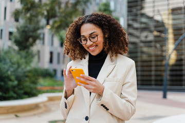 Female Entrepreneur Using Cellphone Outside