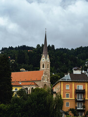 Fototapeta premium Church Saint Nicholas (Nikolaus) in Innsbruck, Tyrol, Austria, cloudy sky summer