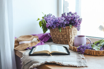 Open bible in spring interior, good morning concept