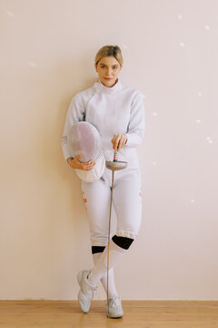 portrait of young woman with fencing uniform .