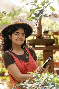 Vertical portrait of a young woman in a nursery 
