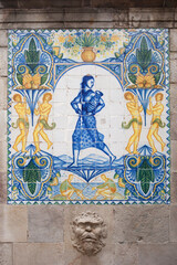 Fototapeta na wymiar El Font de Santa Ana. Barcelonas Oldest Fountain, Spain. Tile glazed wall and relief