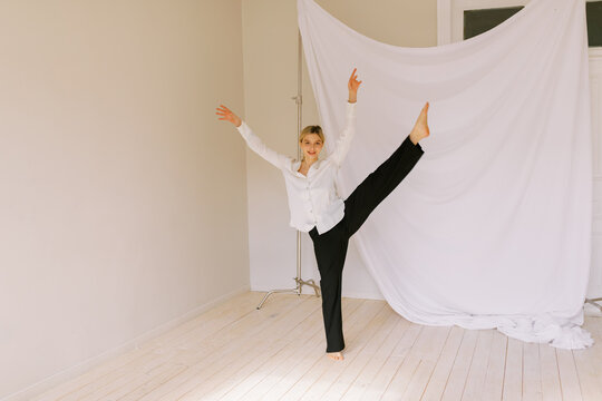 blond woman making leg swing