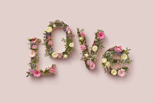 Flowers in cardboard boxes in shape of LOVE word.