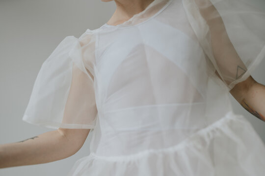 Woman with see through airy dress posing in various light 