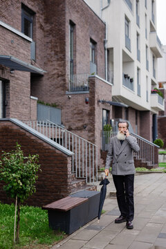 Maturity classy outfit building phone conversation wait neighbourhood