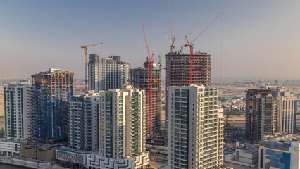 Fototapeta na wymiar Towers at the Business Bay aerial timelapse in Dubai, United Arab Emirates