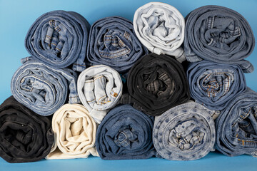 Front view, rolls of jeans. Texture of denim fabric.