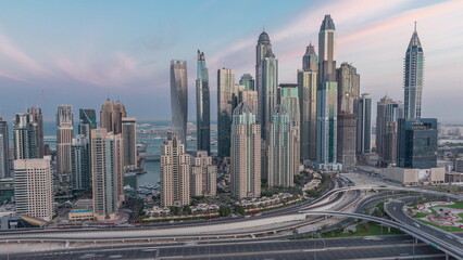 Obraz na płótnie Canvas Dubai Marina highway intersection spaghetti junction night to day timelapse