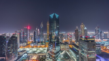 Panorama of futuristic skyscrapers in financial district business center in Dubai all night...