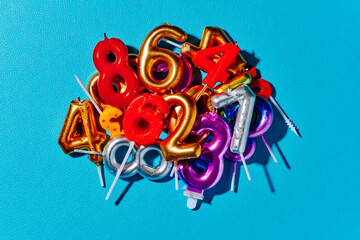 pile of used number-shaped candles