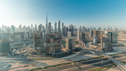 Naklejka na ściany i meble Panoramic skyline of Dubai with business bay and downtown district all day timelapse.