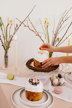 Anonymous woman decorate Easter cake
