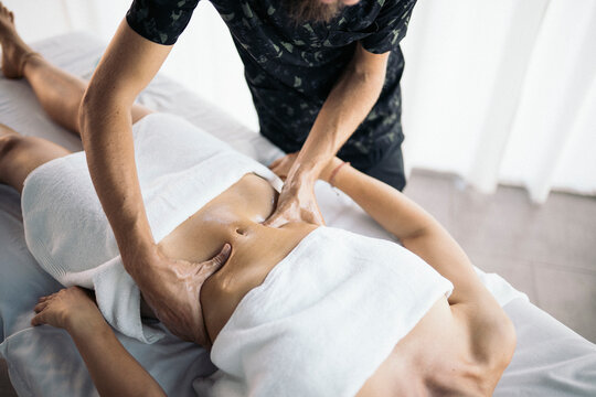 Therapist massaging a patient's stomach