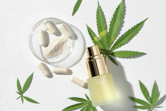 Various glass bottles with CBD oil, THC tincture, capsules