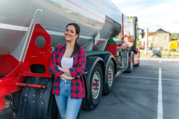 A young woman poses in front of her first cargo truck before embarking on a cross-country tour