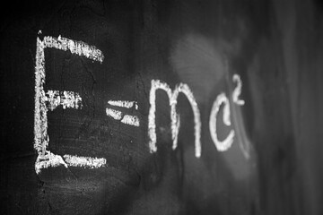 Theory of relativity. Albert Einstein. Physical formula. Black school board.E mc2