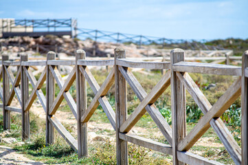 Wooden fence on Algarve coast outside Lagos, Portugal.