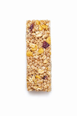 A muesli bar made from oatmeal on a white isolated background. Healthy sweet dessert snack. Cereal muesli with nuts, oatmeal and berries on a white background