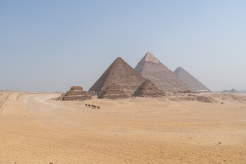 The Giza pyramid complex also called the Giza Necropolis against the blue sky in cairo egypt - obrazy, fototapety, plakaty