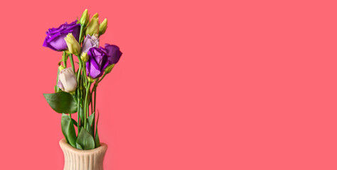Vase with beautiful eustoma flowers on red background with space for text