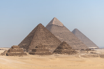 Fototapeta na wymiar The Giza pyramid complex also called the Giza Necropolis against the blue sky in cairo egypt