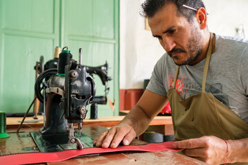 Dressmaker making up a garment on a machine