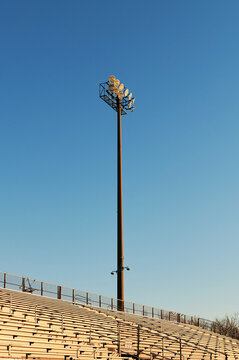 An Empty Stadium Stand against a blue sky, sunrise 
