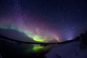 Northern Lights Creates a Display of Light and Color On the Starry Sky