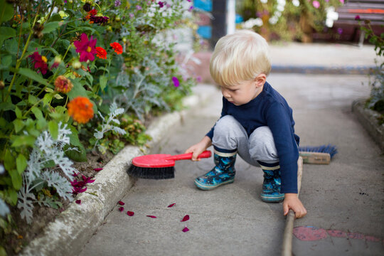 little boy with cleaning brush 