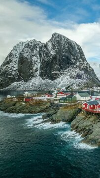 Timelapse of famous iconic traditional fishing village Hamnoy on Lofoten Islands, Norway with red rorbu houses
