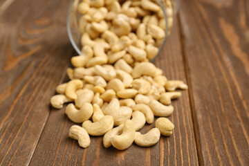 Heap of tasty cashew nut on wooden background