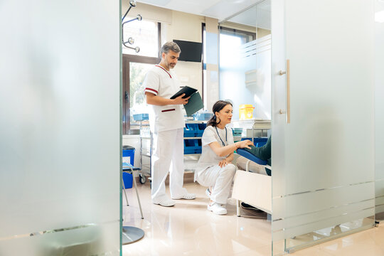 Doctor and nurse attending a patient in the hospital